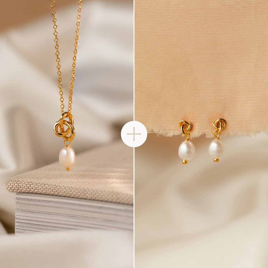 The Knot Pearl Necklace & Earrings Set, featuring delicate pearl drops, is elegantly displayed on a soft beige fabric background—making it a timeless gift for her.