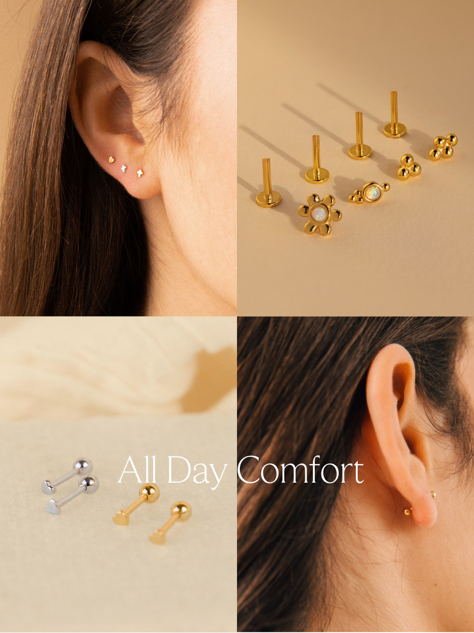 A collage banner with text "all day comfort" featuring a nap earring collection. 1 photo features a jewelry model showcasing an earring stack consisting of a gold heart stud and 2 silver cross stud earrings. 2nd photo features a flatlay of opal cluster flatback studs. 3rd photo features a flatlay of silver and gold heart ball back studs. 4th photo features a jewelry model showcasing a gold ball back stud.