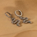 Créoles à breloques serpent pavées