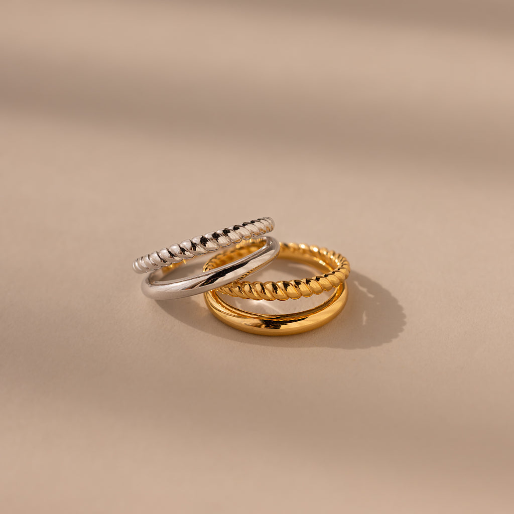 Chelsea Duo Ring in gold and silver versions stacked together on neutral background.