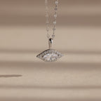 Silver Pave Evil Eye Charm hanging from a silver mirror chain