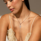 Model wears a silver Rolo Circle Necklace with a silver Pave Cross Charm attached to it.