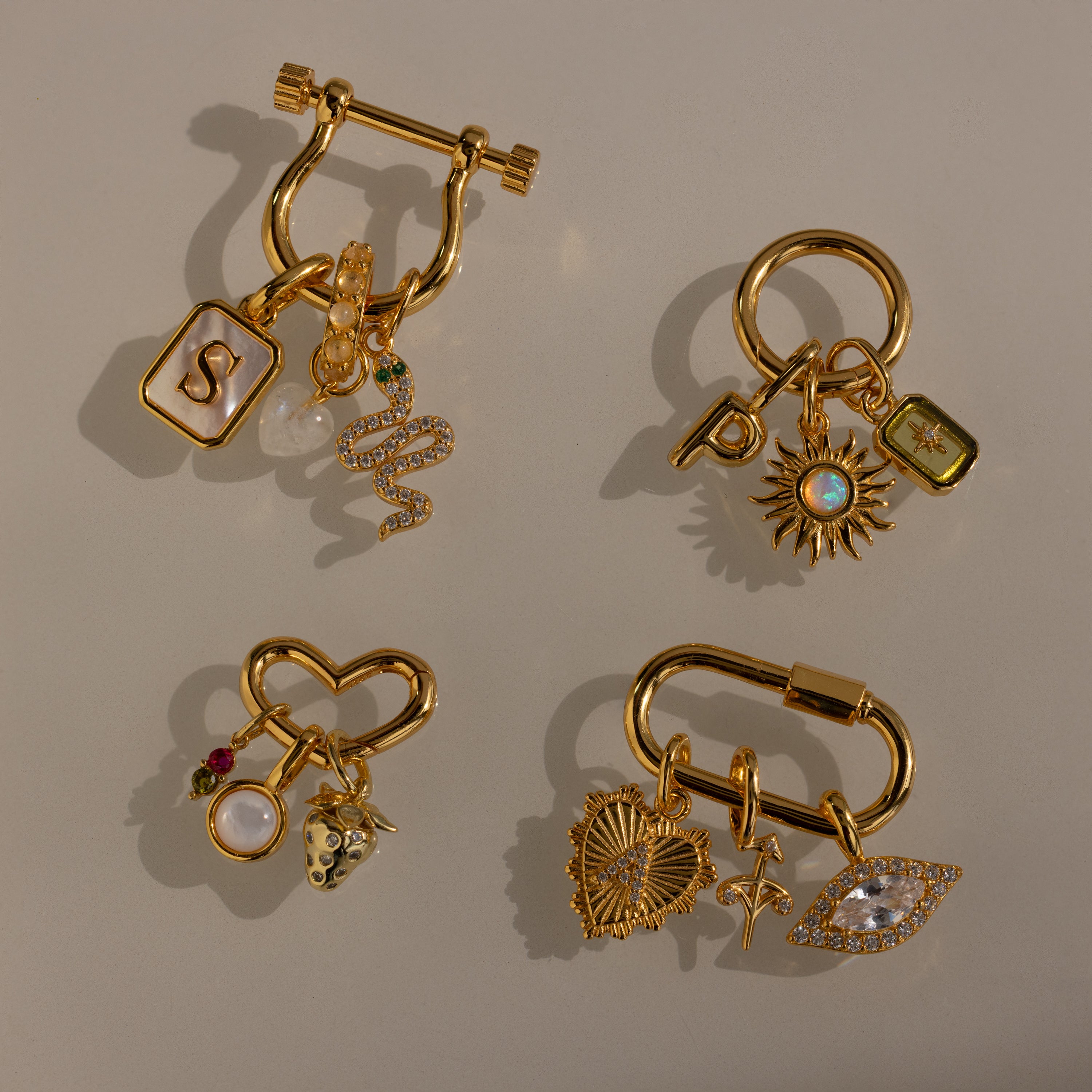 Explore endless style options with our Bar & Carabiner Charm Set, featuring four gold charm jewelry sets with letters, hearts, stars, and gemstones—perfect for mixing or adding to your favorite necklace accessories.