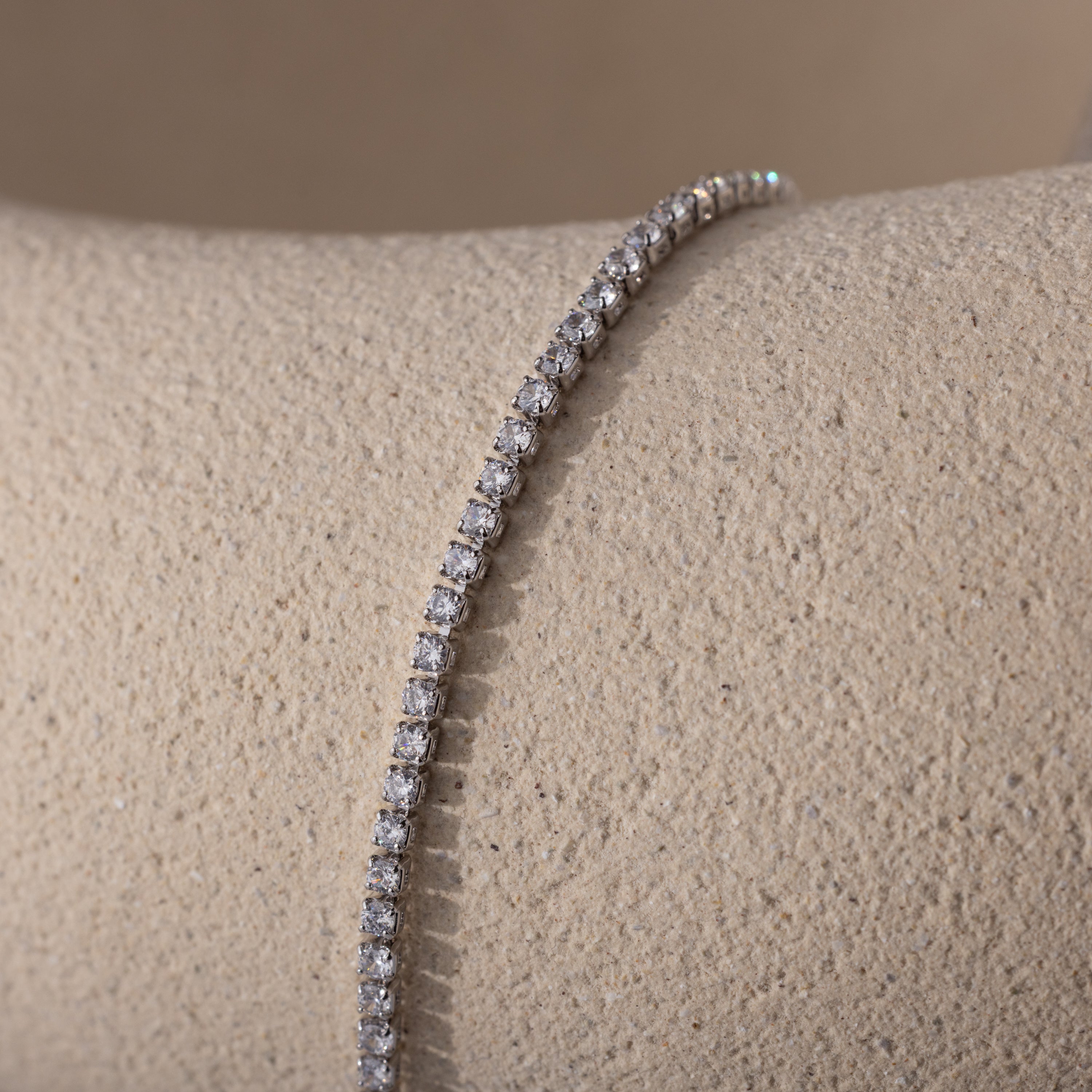 A detailed close-up of the Diamond Tennis Choker Necklace in white gold, showing a tightly arranged row of sparkling round-cut diamonds