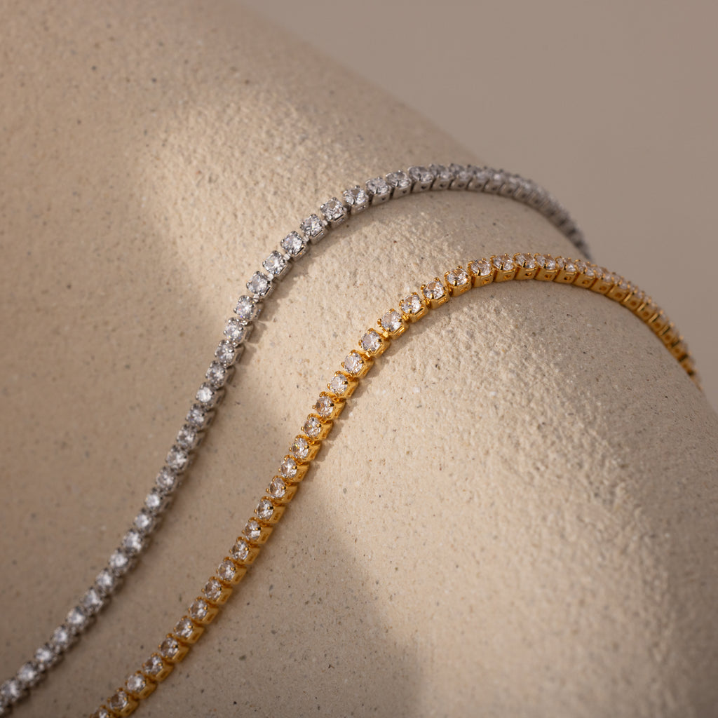 Side-by-side comparison of two Diamond Tennis Choker Necklaces—one in 18K gold and the other in White Gold