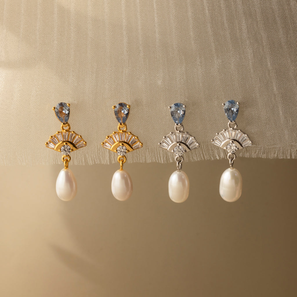 Four pairs of Aquamarine Pearl Drop Earrings with gold and silver settings evoke vintage glamour, making them perfect for weddings. Displayed on a neutral background, each pair brings timeless elegance to any outfit.