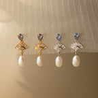 Four pairs of Aquamarine Pearl Drop Earrings with gold and silver settings evoke vintage glamour, making them perfect for weddings. Displayed on a neutral background, each pair brings timeless elegance to any outfit.