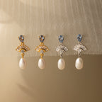 Aquamarine Pearl Drop Earrings in gold and silver evoke vintage glamour on sheer, textured fabric—perfect as timeless wedding earrings.