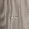 Mellow Name Necklace with "Brianna" shown on a textured, light background—a stylish personalized necklace for any occasion.