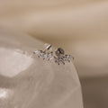 Close-up of Marquise Diamond Climbers in Silver, featuring small marquise-shaped crystals on a smooth white stone—an elegant choice for wedding jewelry.