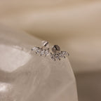 Close-up of Marquise Diamond Climbers in Silver, featuring small marquise-shaped crystals on a smooth white stone—an elegant choice for wedding jewelry.