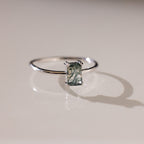Silver Agate Emerald Ring resting on a flat surface