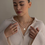 Woman wearing a cream sweater and the Dainty Duo Pearl Necklace in 18K Gold—an elegant gift for loved ones or as timeless wedding jewelry.