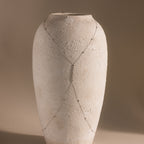 Close-up of the silver Sprinkle Diamond Body Chain displayed on a white ceramic vase, showing the full Y-shaped design and sparkling bezel-set stones.