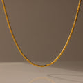 The Bold Link Chain Necklace in 18K Gold is displayed against a neutral, softly lit background.