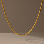 The Bold Link Chain Necklace in 18K Gold is displayed against a neutral, softly lit background.