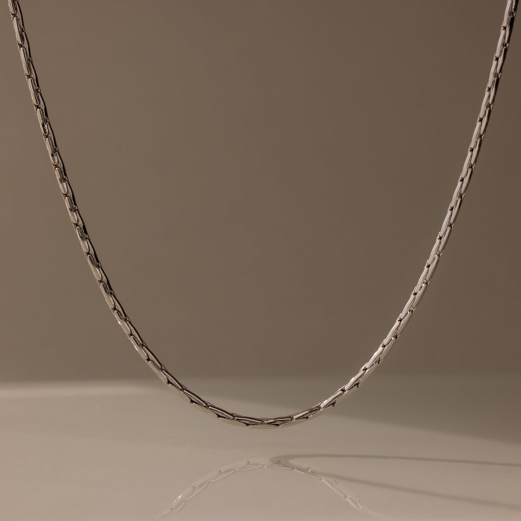 The Bold Link Chain Necklace in Silver stands out against a plain, neutral background.