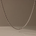 The Bold Link Chain Necklace in Silver stands out against a plain, neutral background.