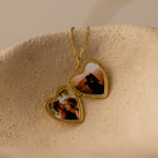 Close up flatlay image of the inside of our Engraved Heart Locket Necklace in 18K Gold