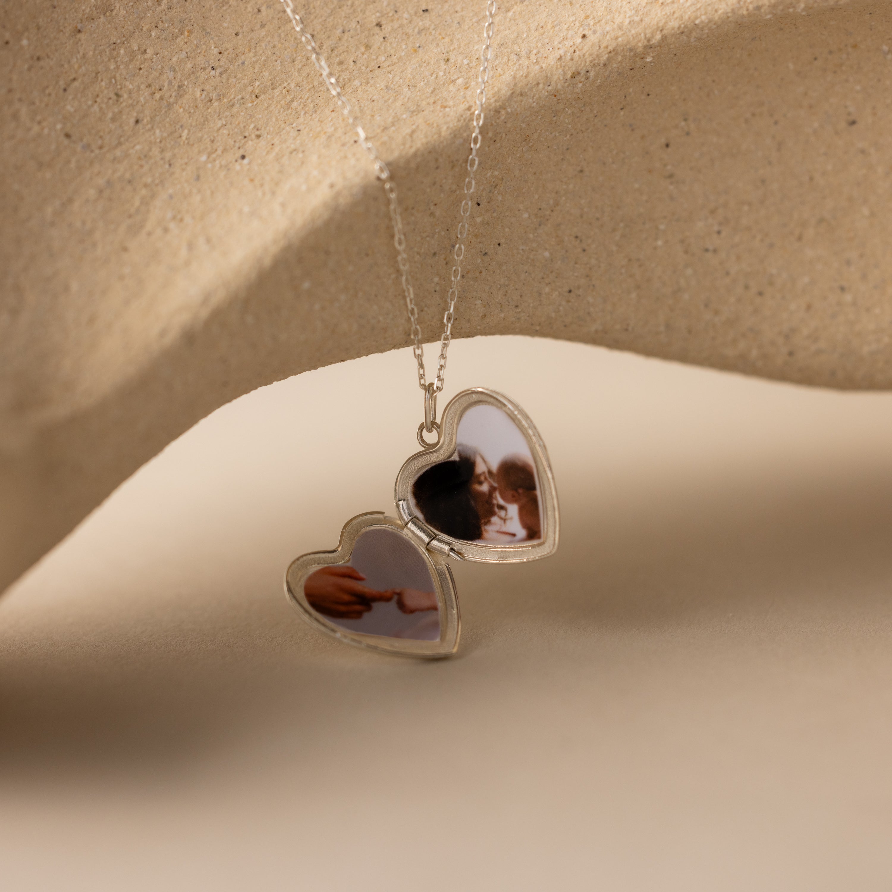 Close up photo of the inside of our Handwriting Heart Locket Necklace in Silver