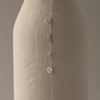 The Dainty Space Charm Necklace in Sterling Silver, featuring letter, heart, bead, and number charms, drapes beautifully—ideal to pair with a silver chain bracelet for a unique personalized style.