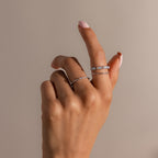 A hand with light pink nails wears the Pave Opal Ring Set in Sterling Silver, shown against a plain beige background.