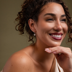 Model showcasing our Diamond Poinsettia Hoops in Silver finish