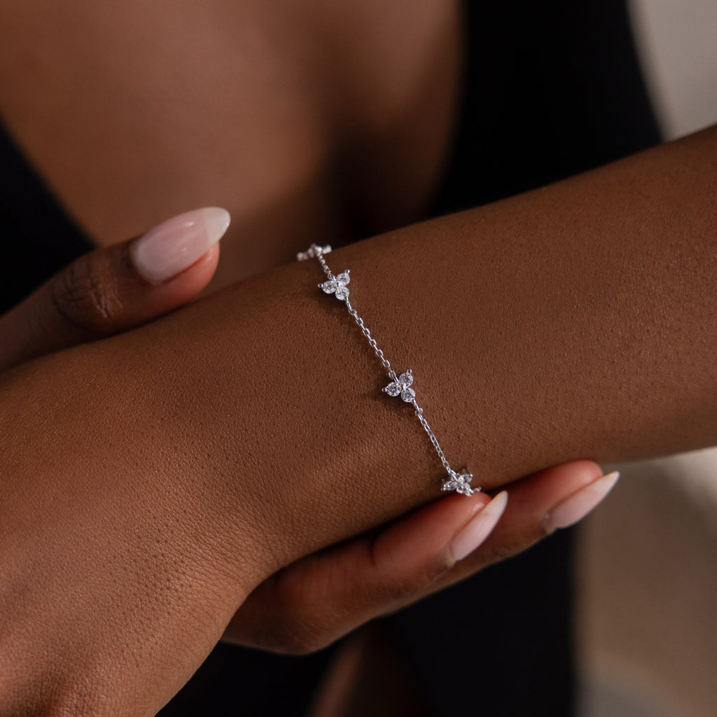 Silver bracelet on a wrist with a blurred background