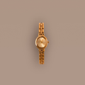 Our Cobblestone Timepiece watch on a beige background