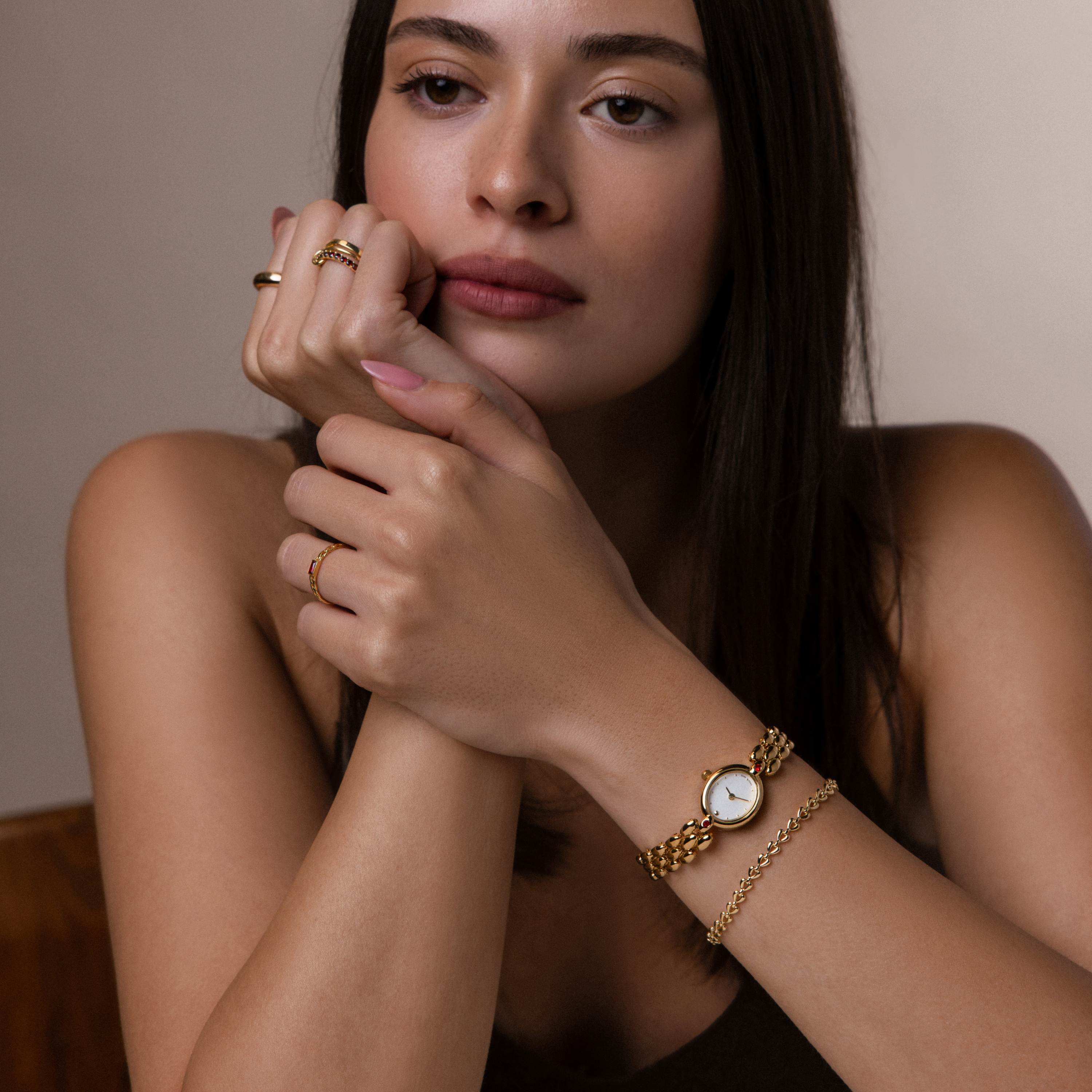 Model showcasing a styled look featuring our Cherry Blossom Timepiece watch, styled with our Tiny Heart Link Bracelet and Linked Ring Set