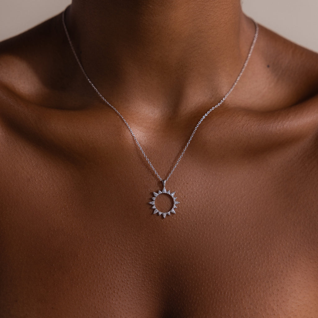 The Pave Sun Necklace features glittering pave accents and rests elegantly on the neck and collarbone.