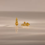 Two gold and diamond Ombre Topaz Flatback Studs are displayed on a smooth, reflective surface with a neutral background.