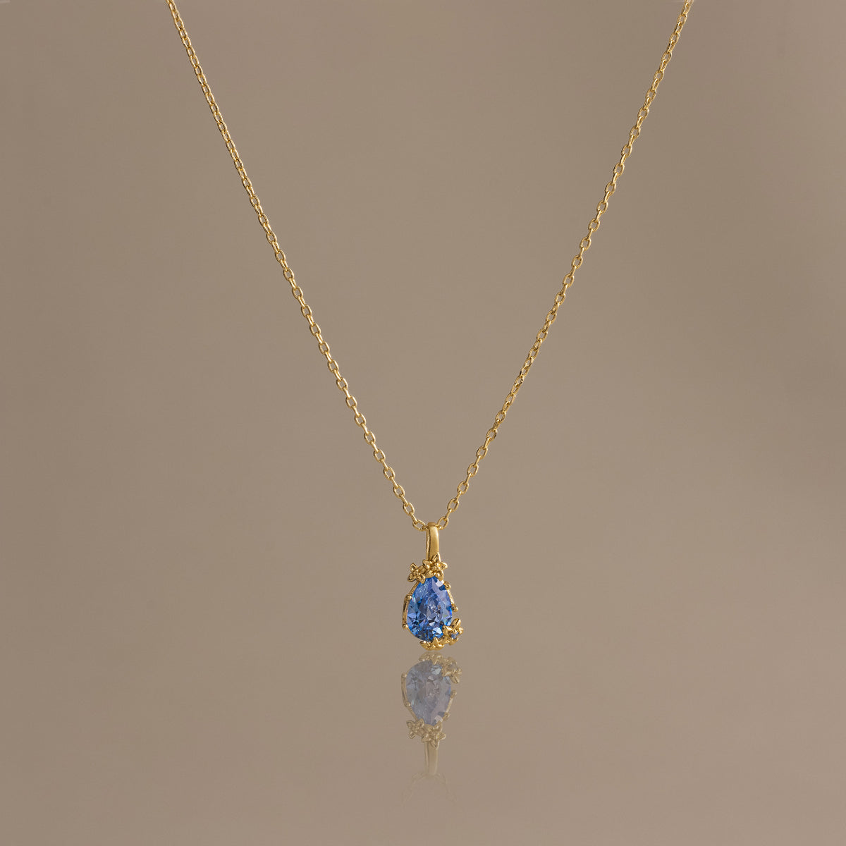 Blue Zircon Blossom Charm Necklace