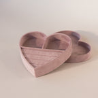 Empty heart-shaped velvet jewelry box in lavender with ring slots and compartments, shown with matching lid beside it.