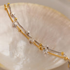 Close up of Mixed Metal Star Bracelet laying flat side on a dish.