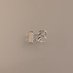 Double Layering Clasp in Silver with dual lobster clasps and three loops for easy necklace layering, displayed on a plain beige background.