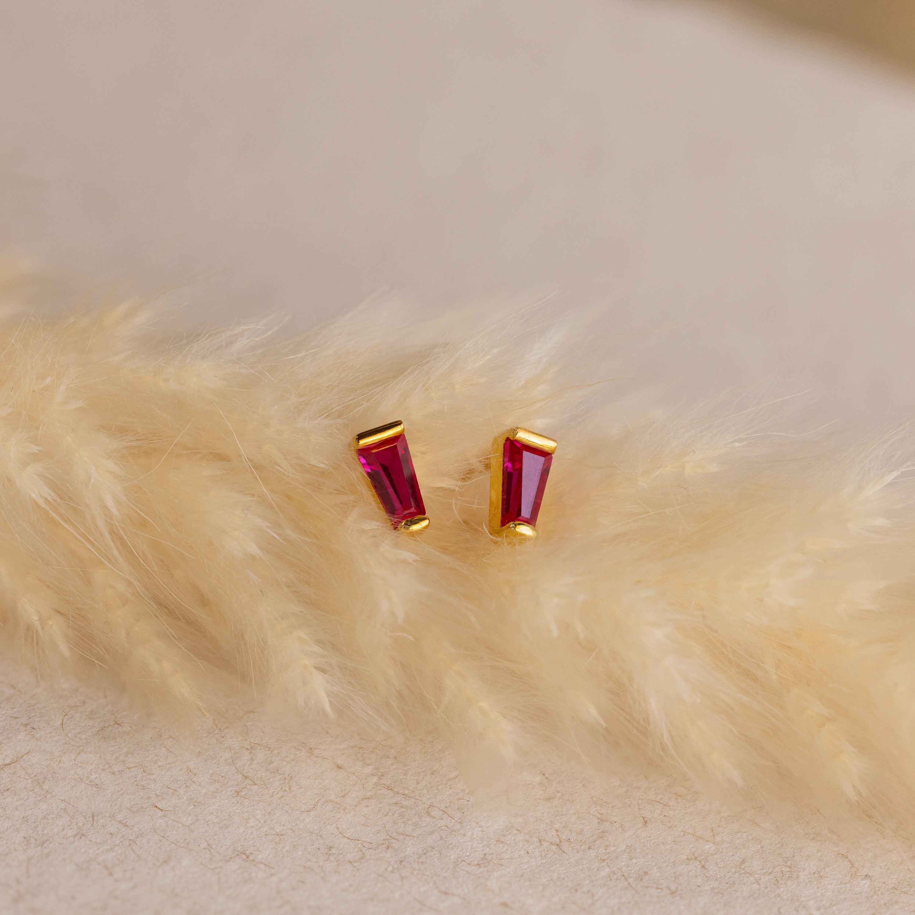 Tapered Baguette Birthstone Studs—gold stud earrings featuring vivid red gemstones—add timeless elegance to any look, making them the perfect choice for gemstone jewelry lovers.