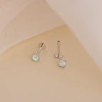 Experience effortless everyday elegance with the Opal Flat Back Studs in Sterling Silver, featuring a comfortable fit and a striking white gem.