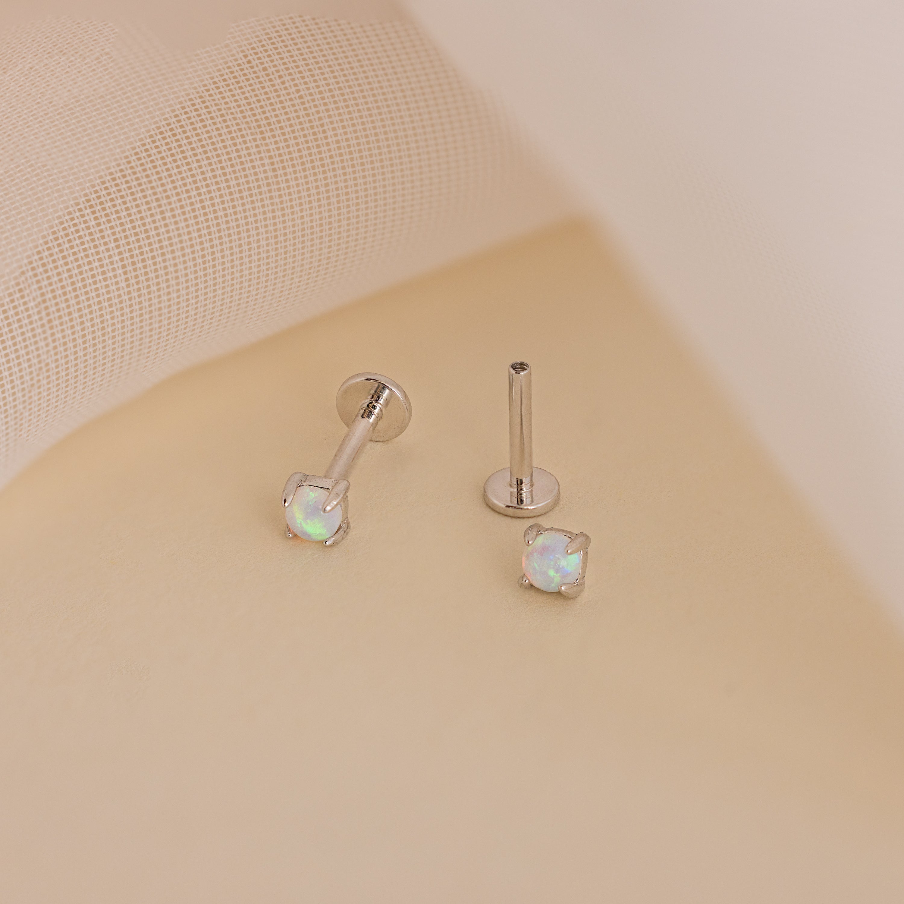 Experience effortless everyday elegance with the Opal Flat Back Studs in Sterling Silver, featuring a comfortable fit and a striking white gem.