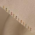Birthstone Drop Studs, available in vibrant pairs, are displayed on a textured beige fabric—perfect for unique birth month jewelry gifts.