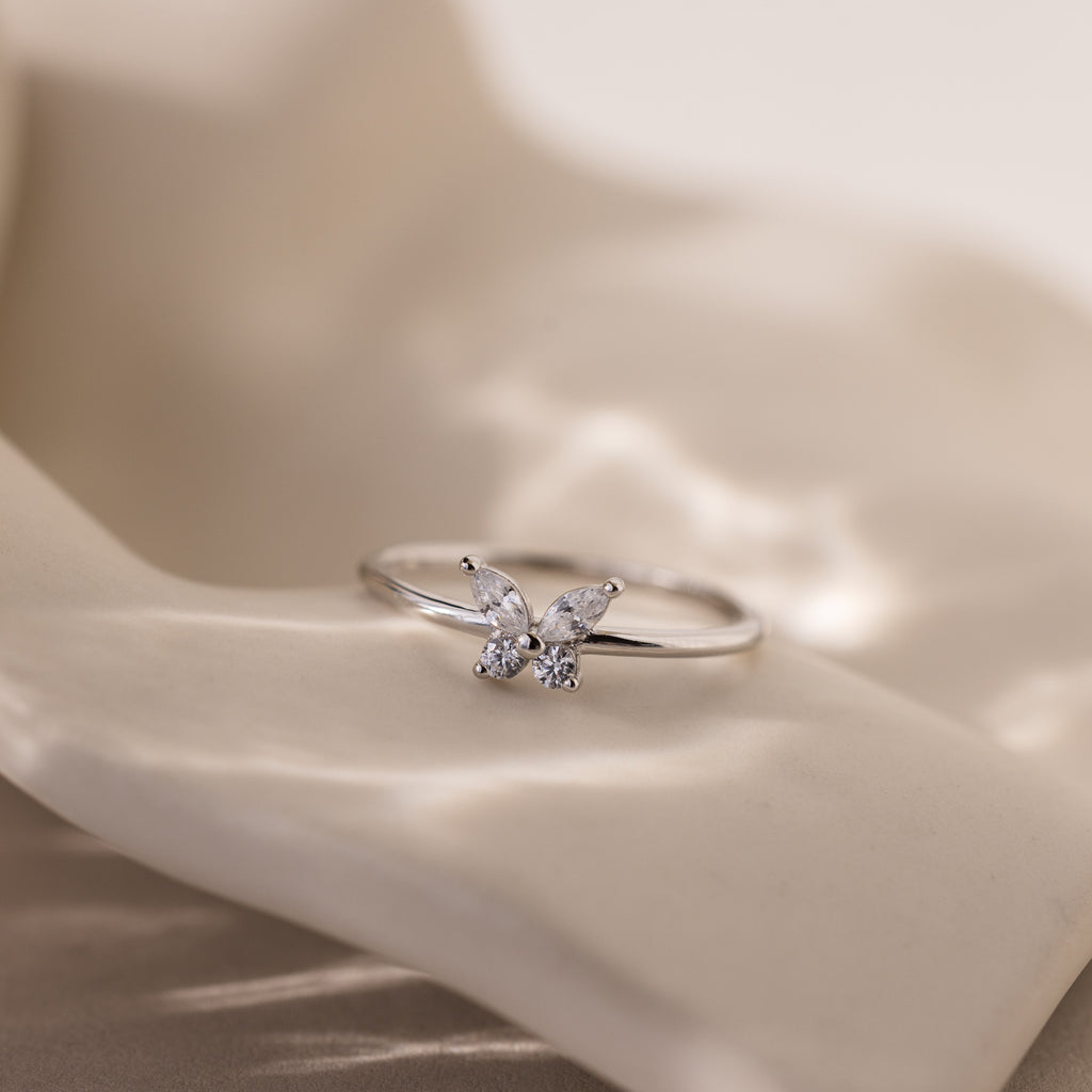 The Mariposa Diamond Ring sparkles brilliantly with CZ stones, making it perfect as a friendship ring or a meaningful butterfly promise ring.