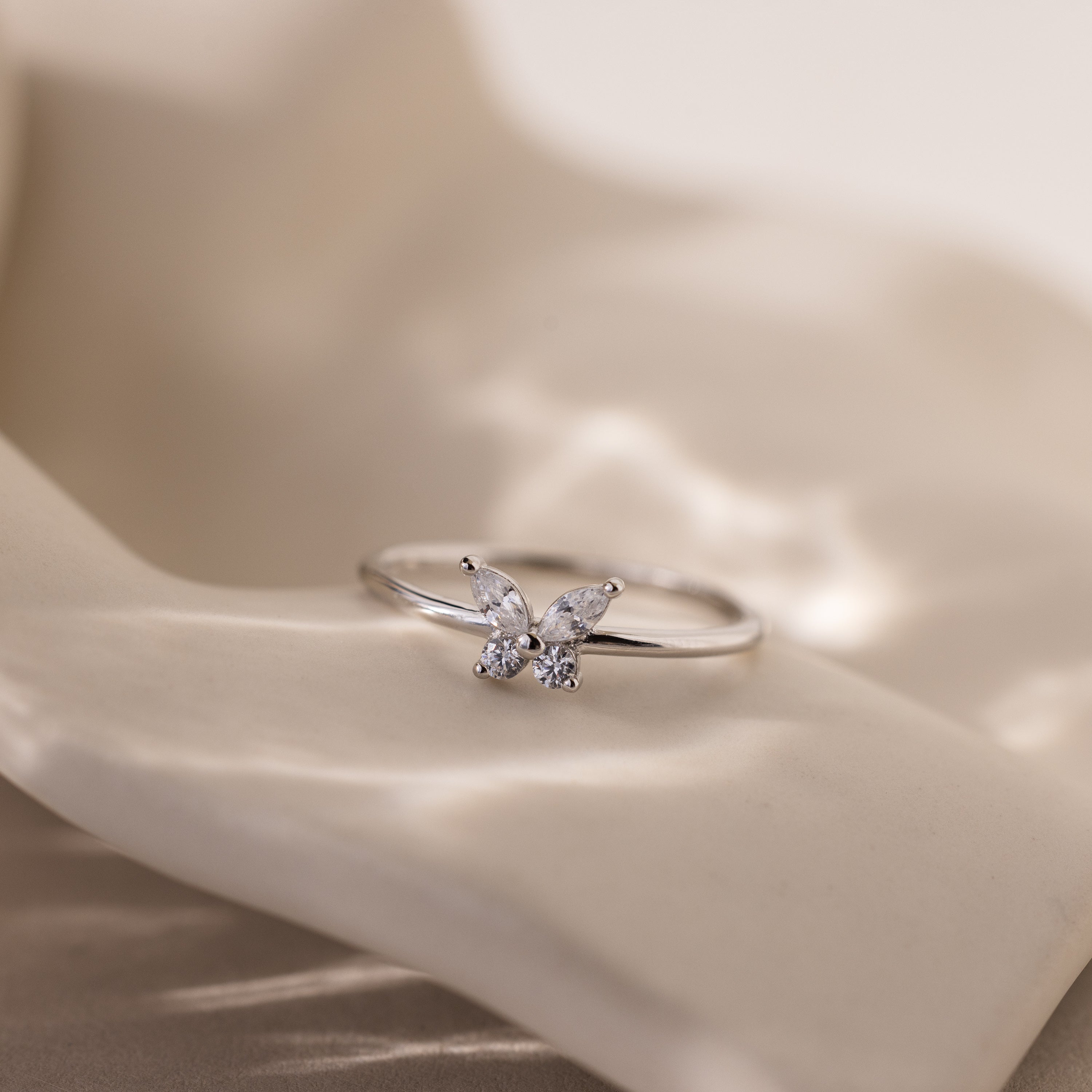 The Mariposa Diamond Ring sparkles brilliantly with CZ stones, making it perfect as a friendship ring or a meaningful butterfly promise ring.