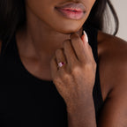A woman in a black top displays the Toi et Moi Birthstone Ring in Sterling Silver, her hand resting on her chin—an elegant and customizable choice for a Christmas gift.