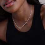 Close-up of a woman in a black tank top wearing the Dainty Link Chain Necklace.