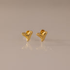 Shark Tooth Flatback Studs in gold, ideal beach accessory, shown on a neutral surface.