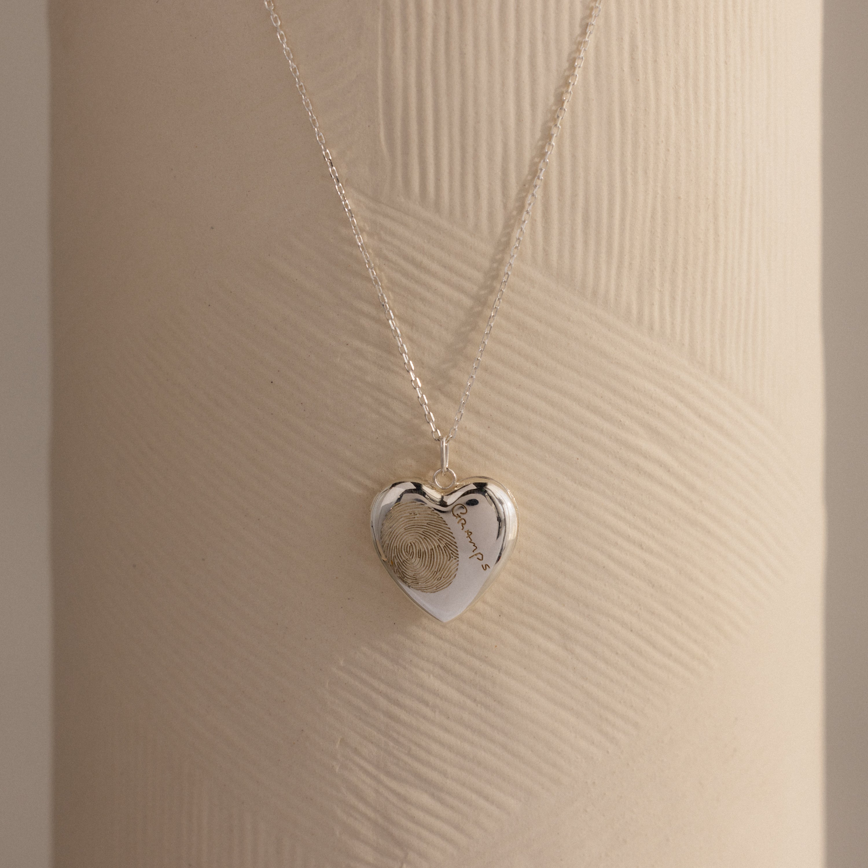 Close up image of our Fingerprint Heart Locket Necklace in Sterling Silver