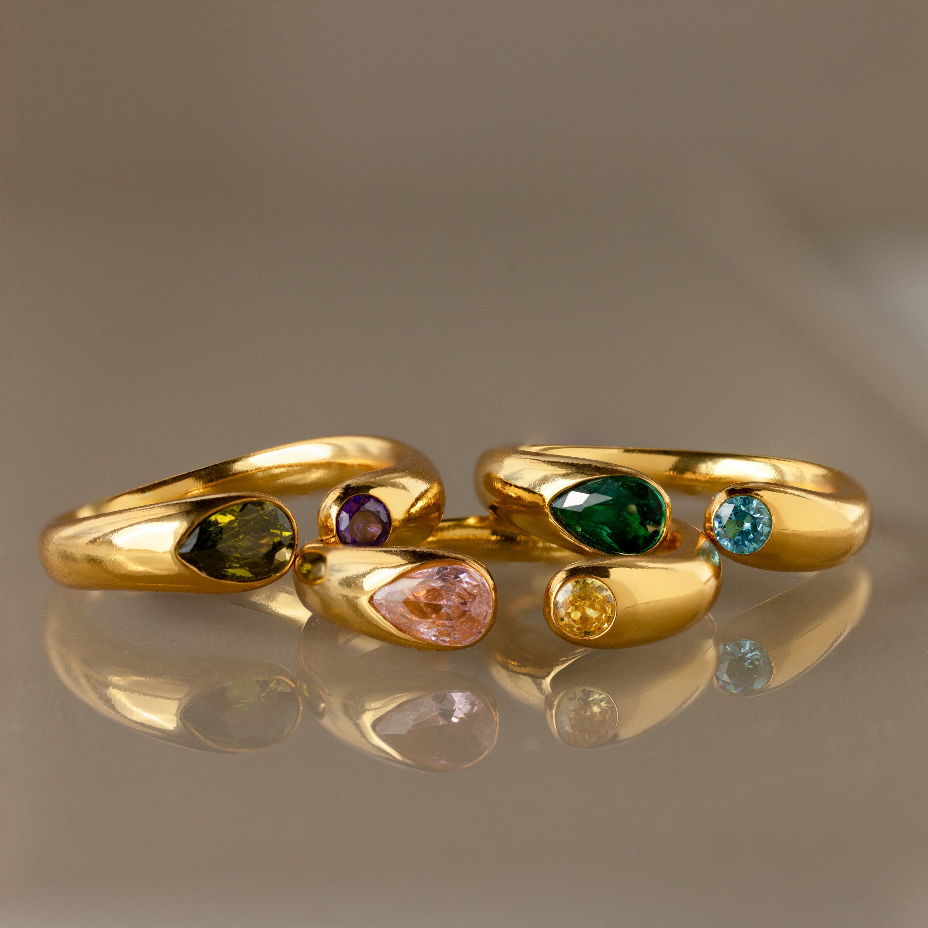 The Toi et Moi Birthstone Signet Ring shines with vibrant green, pink, blue, yellow, and purple gemstones. Celebrate your unique style and story with this customizable gemstone ring.