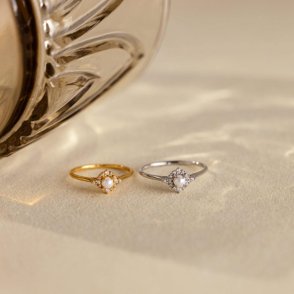 The Vintage Pave Pearl Ring in 18K Gold showcases a central pearl with pavé diamonds in a square setting on a reflective gold band—an elegant and exquisite Christmas gift choice.