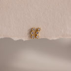 Alexandrite Cluster Flatback Studs featuring small, sparkling stones, displayed on a textured, off-white paper background.