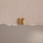 Topaz Cluster Flatback Studs are displayed on torn beige paper against a neutral background.